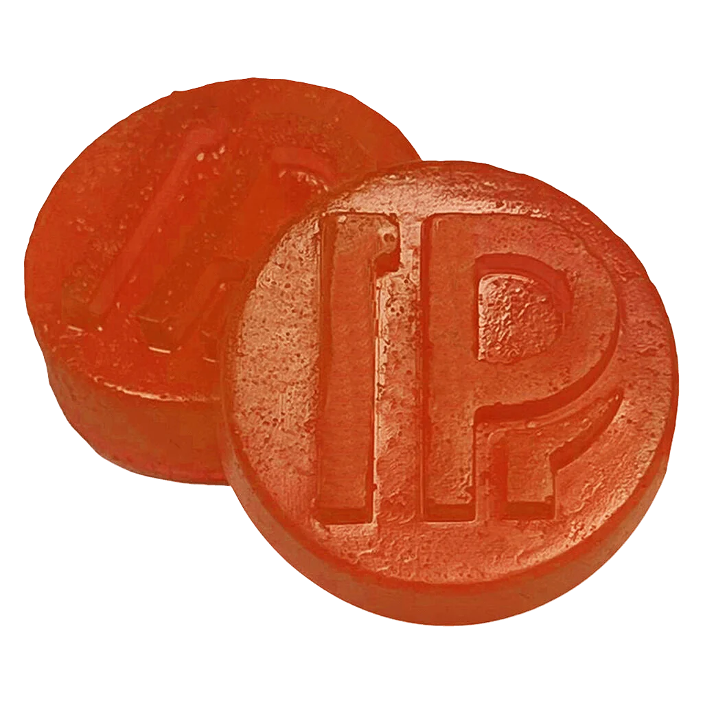 Pistol and Paris Orange Tingz live rosin gummies, two round orange soft chews with embossed branding